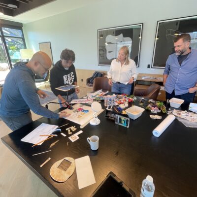 Team collaborating on crafting props for a stop motion animation project during a creative team building event. thumbnail