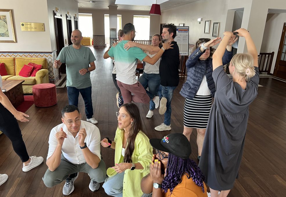 Team building activity focused on human skills training. Participants engage in a creative group challenge, using collaboration, communication, and problem-solving to complete the task.