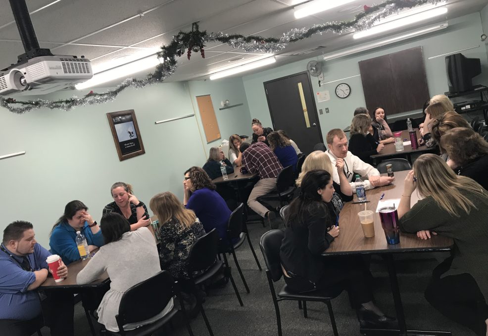 Teams participate in group discussions during a team building session, collaborating and exchanging ideas to strengthen workplace relationships.