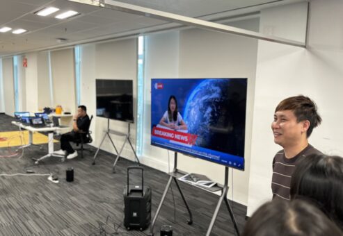 In this photo, a team is presenting their 