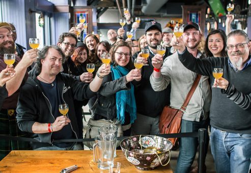 Team celebrating with a toast at the end of a fun and engaging mixology class. The event encouraged collaboration and creativity as participants crafted delicious cocktails together.
